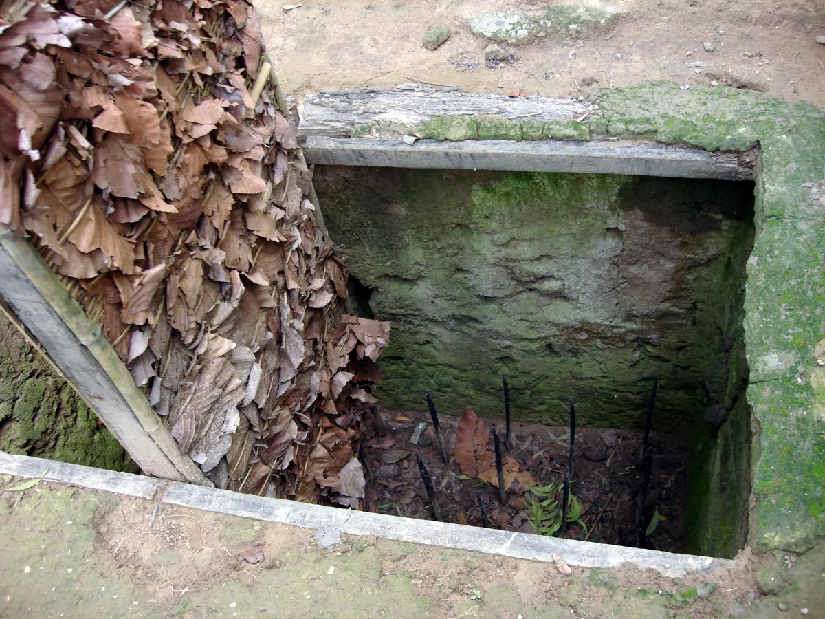 A reconstructed booby trap with bamboo spikes at Cu Chi